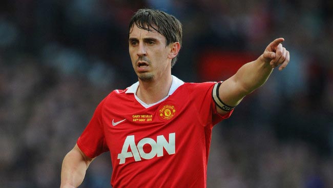 Gary Neville directs his Manchester United teammates while captaining his side in Premier League game in May 2011