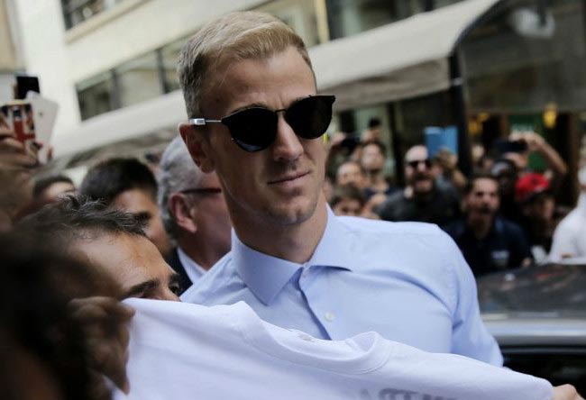 Joe Hart poses with fans while arriving in Turin to complete his transfer to Torino