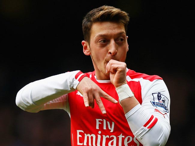 Mesut Ozil celebrates his goal against Tottenham Hotspurs in North London Derby in January 2015