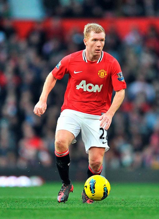 Paul Scholes in action for Manchester United during Premier League match at Old Trafford in 2011