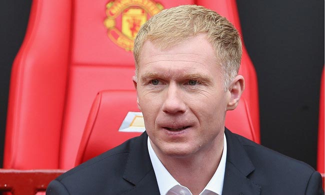 Paul Scholes in Manchester United dugout while working as an assistant manager in April 2014