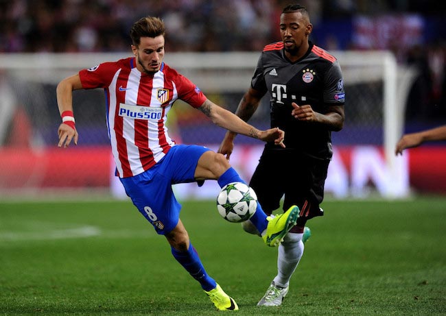 Saul Niguez in duel with Jerome Boateng of Bayern Munich during a Champions League match between Atletico Madrid and Bayern Munich on September 28, 2016