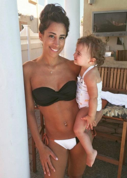 Danielle Jonas shows off her stunning bikini body while holding daughter Alena in September 2015