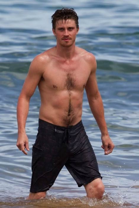 Garrett Hedlund shirtless body at the beach in 2014