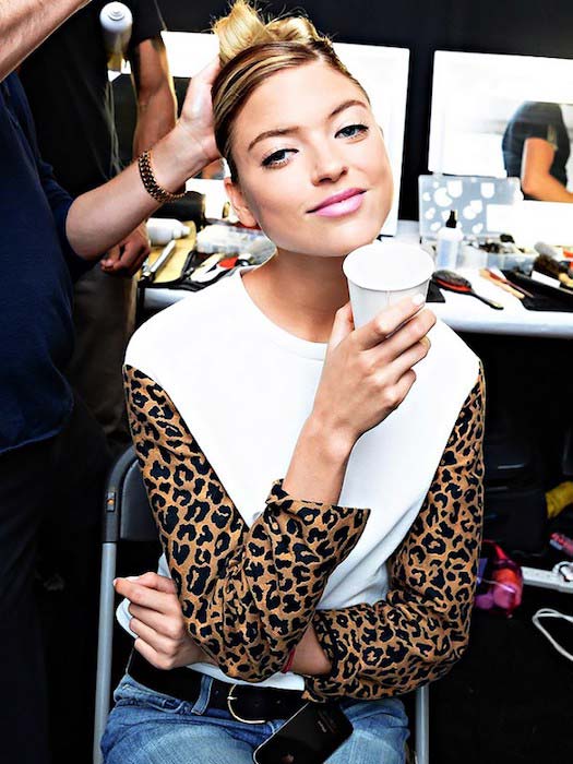 Martha Hunt backstage with a drink