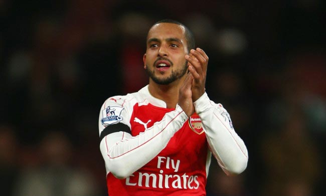 Theo Walcott applauds fans after Arsenal’s 2-0 win against Bournemouth at Emirates Stadium in December 2015