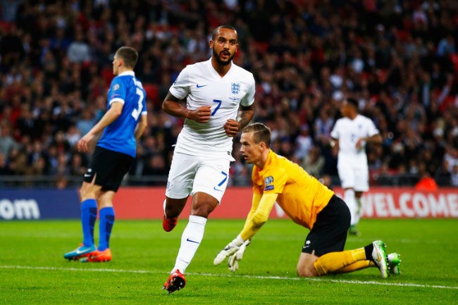 Theo Walcott celebrates after scoring a goal against Estonia at Wembley on October 9, 2015