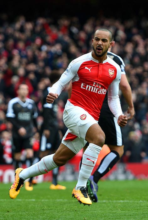 Theo Walcott wheels off in celebration after scoring a goal against Leicester City in February 2016