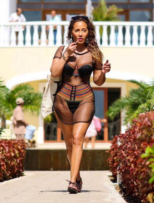 Adrienne Bailon in sheer clothing while on a vacation in Mexico in March 2016
