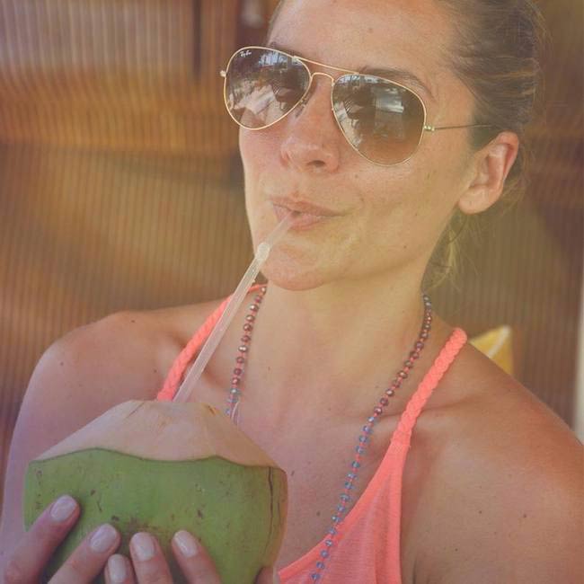 Amanda Byram drinking coconut water