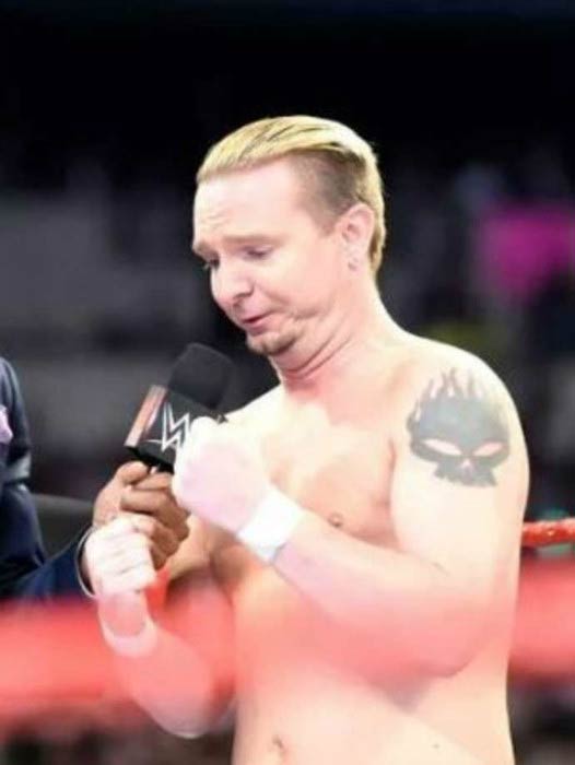 James Ellsworth interacts on stage in an episode of Raw in 2016