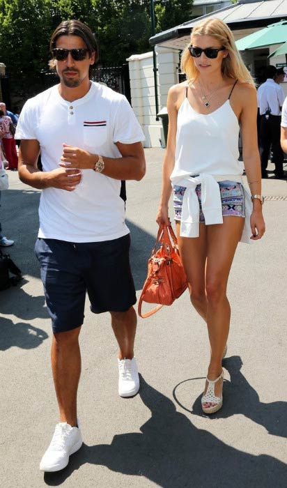 Sami Khedira and Lena Gercke at the Men's Final during Wimbledon Tennis Championships in London in July 2013