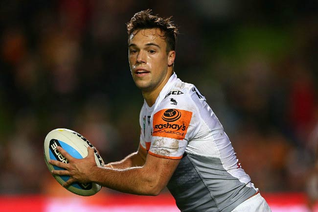 Luke Brooks makes a play during Manly Sea Eagles and Wests Tigers match in June 2015