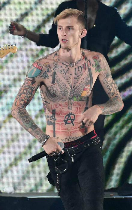 Machine Gun Kelly shirtless performing at the 2015 iHeartRadio Music Festival