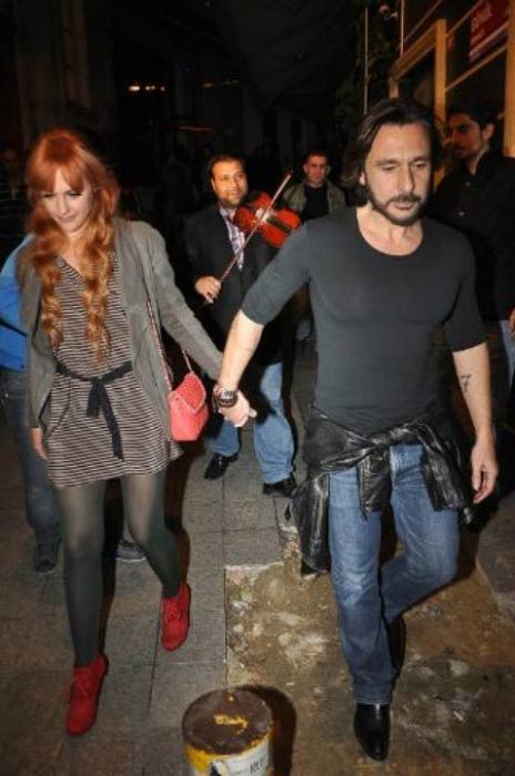 Meryem Uzerli and Can Ateş leaving a restaurant in Istanbul in 2013