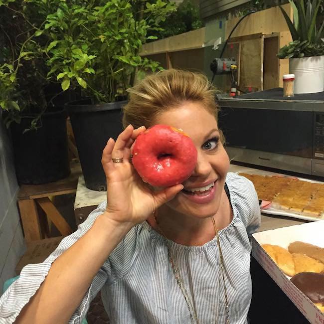 Candace Cameron-Bure showing a donut