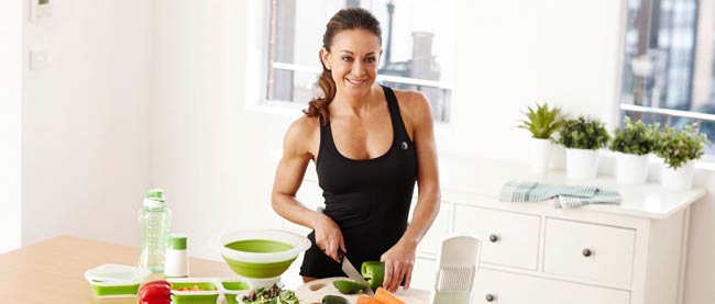 Michelle Bridges preparing food in the kitchen