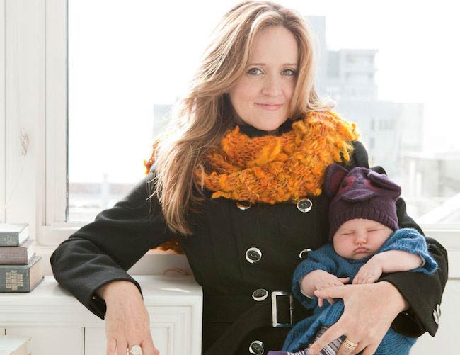 Samantha Bee holding her baby