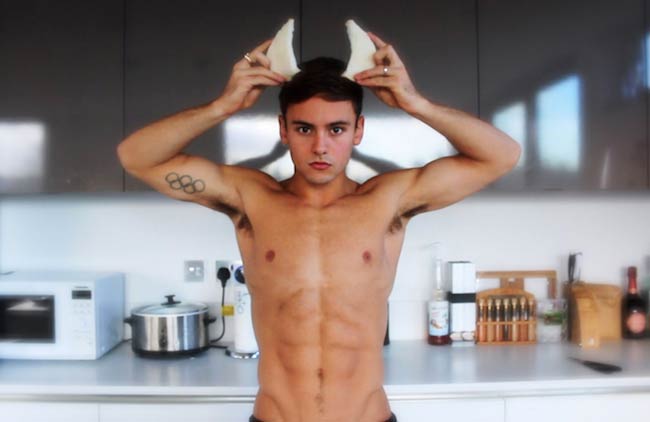 Tom Daley in the kitchen showing his abs