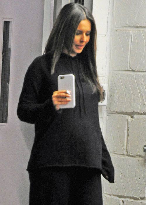 Cheryl Cole showing her baby bump in loose jumper