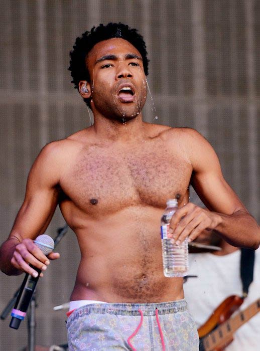 Donald Glover shirtless during a performance at Austin City Limits Music Festival in 2014