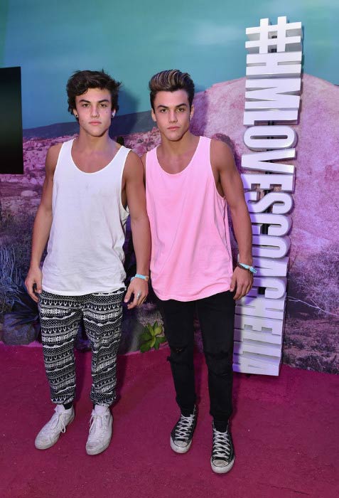 Ethan Dolan (white vest) with his brother Grayson Dolan at the H&M Loves Coachella Pop UP in April 2016