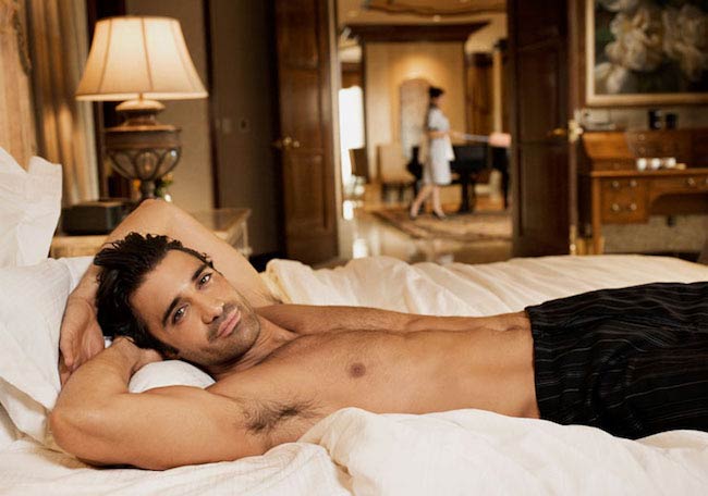 Gilles Marini shirtless lying on bed