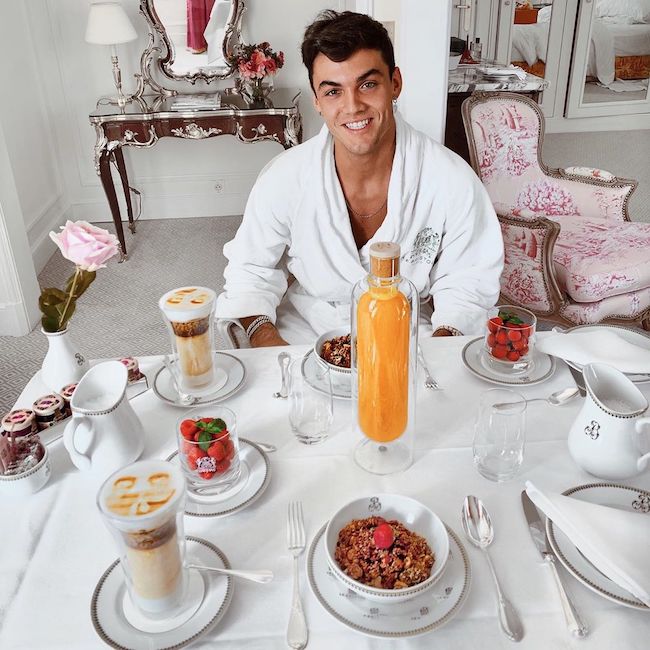 Grayson Dolan having a breakfast in hotel in Paris, France in 2019