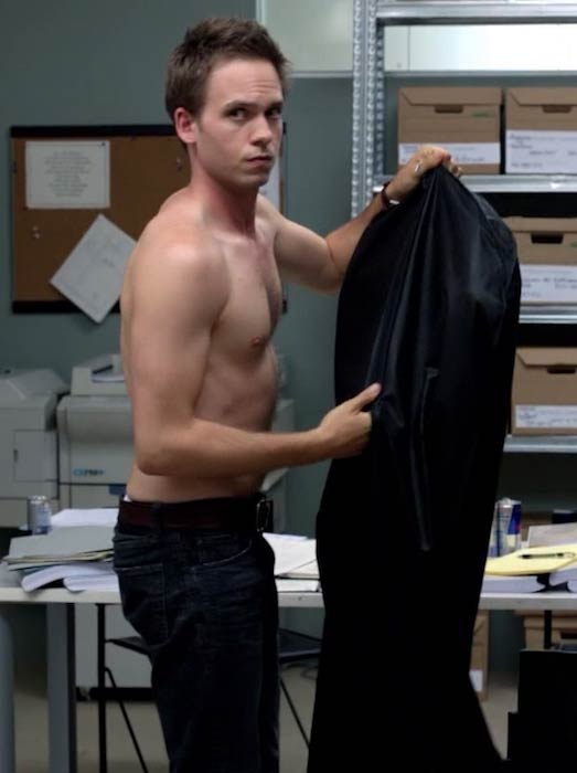 Patrick J. Adams shirtless in a scene from Suits