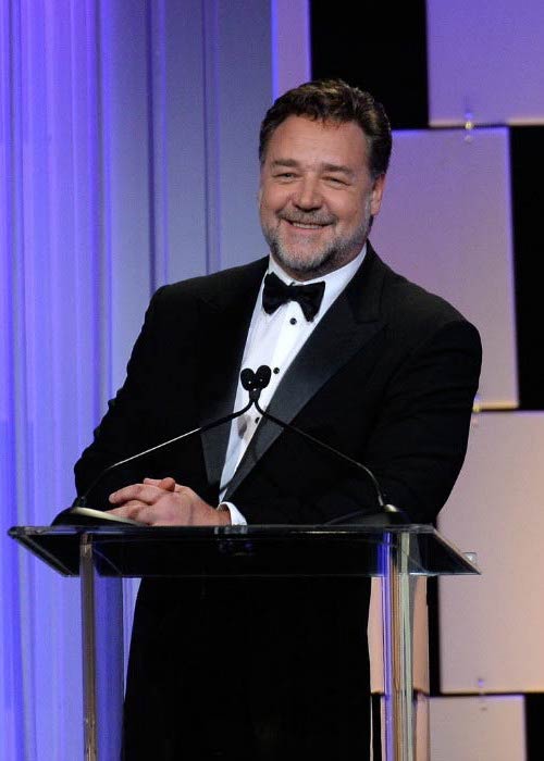 Russell Crowe speaking onstage at the 30th Annual American Cinematheque Awards Gala in October 2016 in California