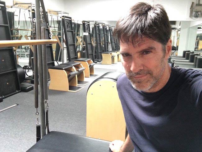 Thomas Gibson shows off a pilates chamber after a workout