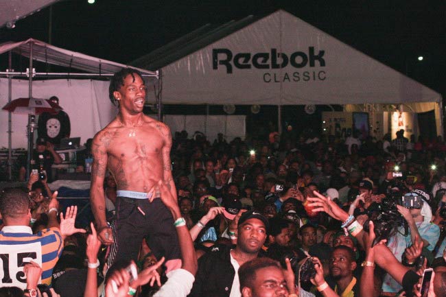 Travis Scott shirtless performing during the Trillectro Music Festival in August 2014