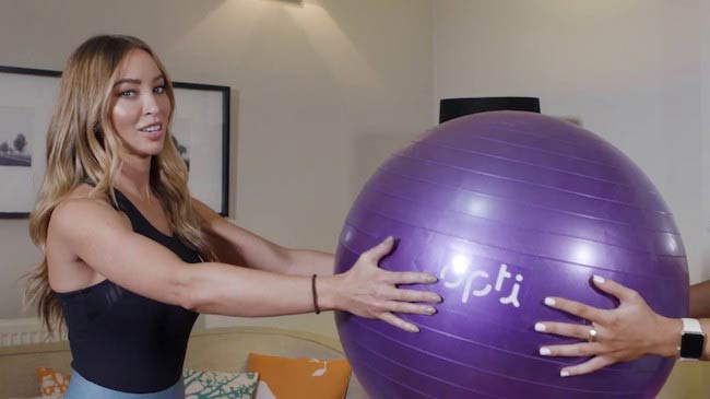 Lauren Pope working out using a fitness ball