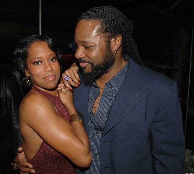 Regina King and Malcolm-Jamal Warner at a public event in 2013