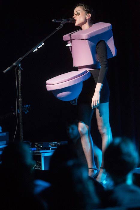 St Vincent wearing a toilet costume while giving performance at a Charity Concert at Le Poisson Rouge in New York in 2016