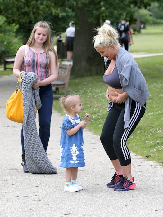 Kerry Katona showing her tummy in the park during an outing