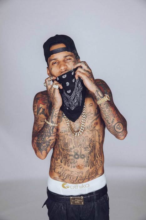 Kid Ink poses for a modeling photoshoot in 2016