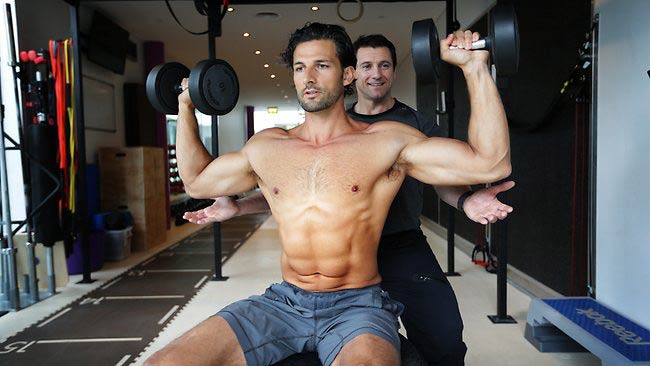 Tim Robards doing shoulder press exercise