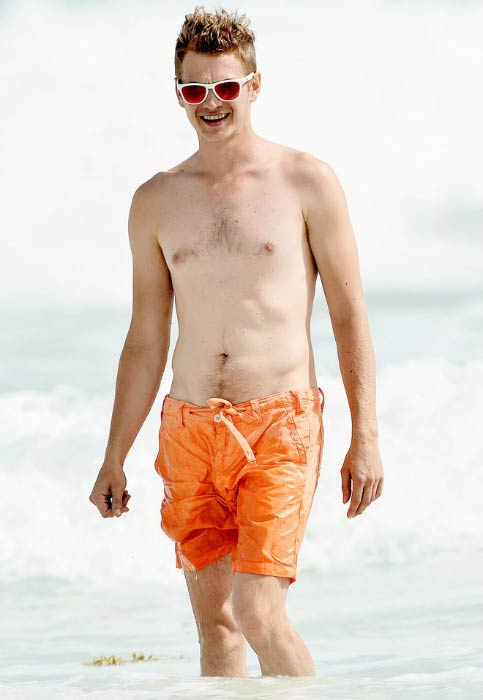 Hayden Christensen shirtless on the beach in Barbados in July 2014 