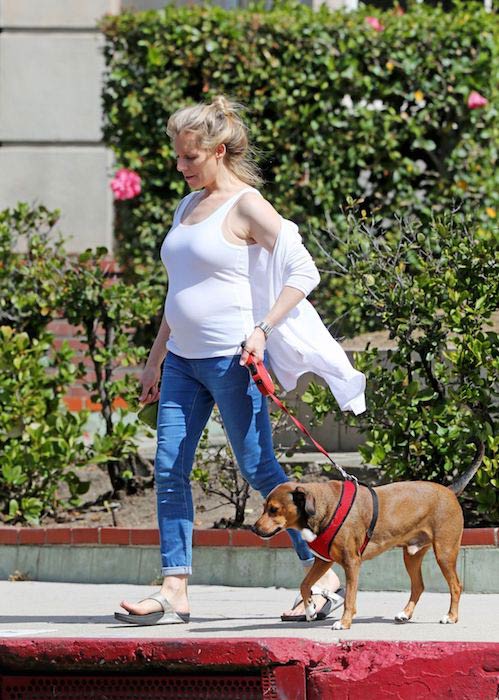Pregnant Abi Titmuss strolling her dog in Los Angeles in April 2017