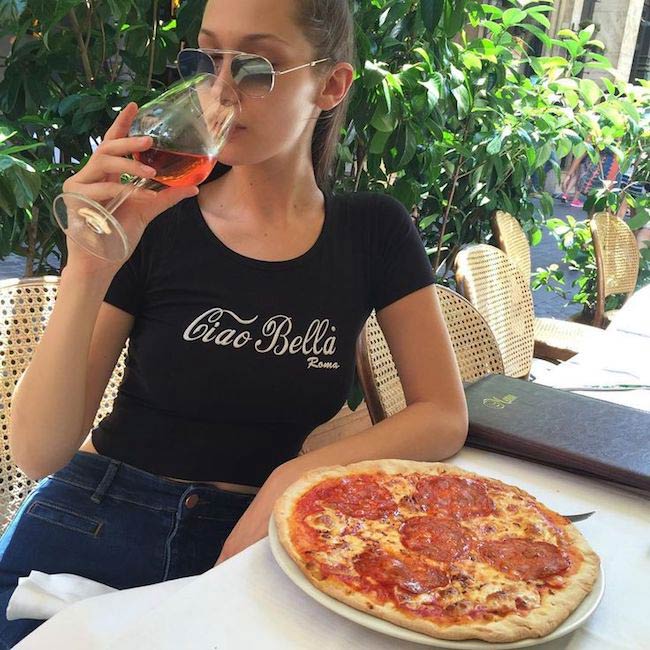 Bella Hadid having pizza