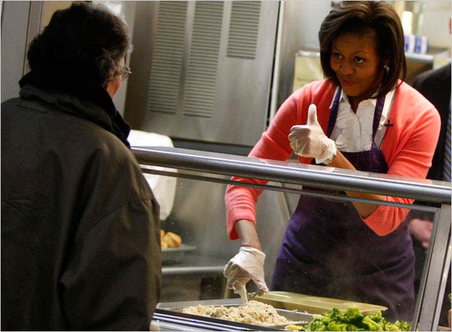 Michelle Obama serving food