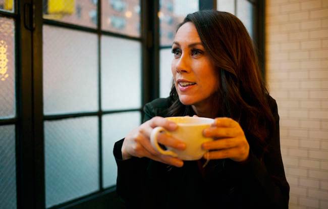 Miriam Shor drinking coffee