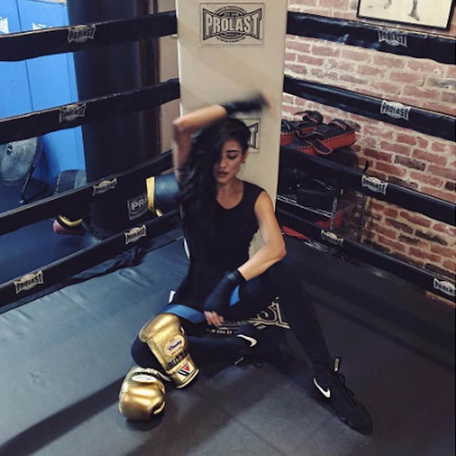 Shay Mitchell in a boxing ring