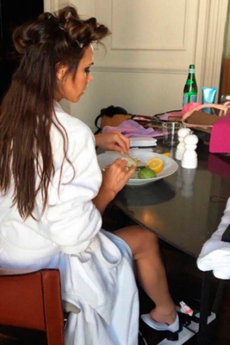 Victoria Beckham having fruits while getting her hair done