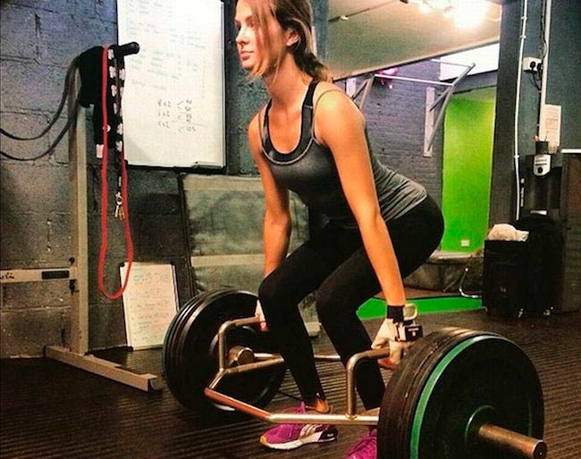 Millie Mackintosh doing deadlift during an intense gym workout