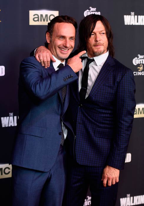 Norman Reedus with co-star Andrew Lincoln at the season 5 premiere party of The Walking Dead in Los Angeles in October 2014