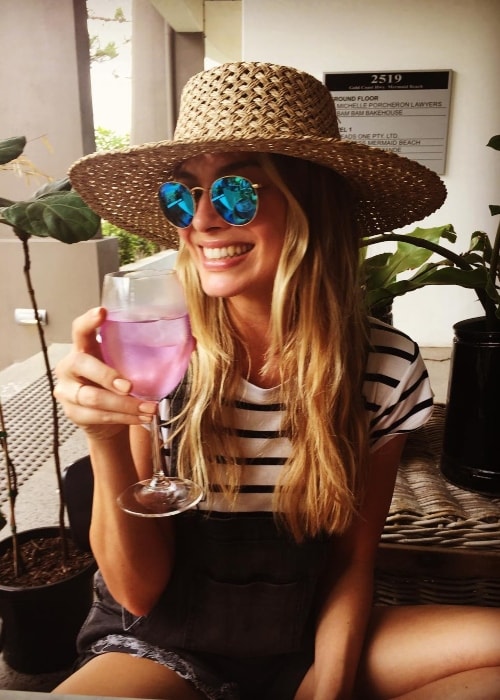 Margot Robbie enjoying her drink in December 2016