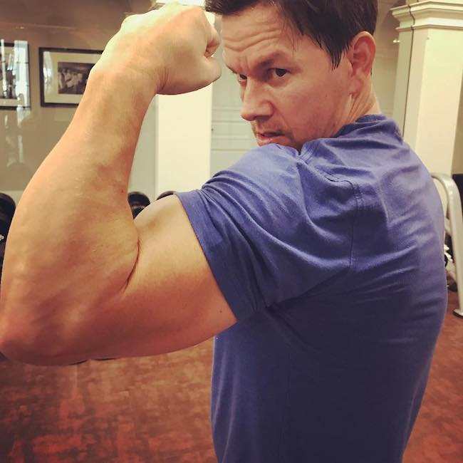 Mark Wahlberg showing his biceps after the Day 1 of training for Mile 22 in August 2017