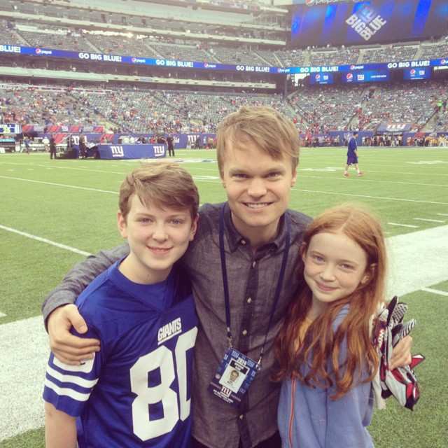 Sadie Sink with brother Mitchell, and agent John Mara Jr. at a football game in 2014 New York Giants vs Houston Texans